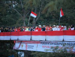 Hujan Deras Tak menyurutkan Dandim bersama Forkopimda Nagan Raya laksanakan Apel Bendera Merah Putih Raksasa