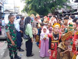 Karnaval Meriah di Desa Blok Bengkel: Babinsa Serma Nazaruddin Berikan Pengamanan